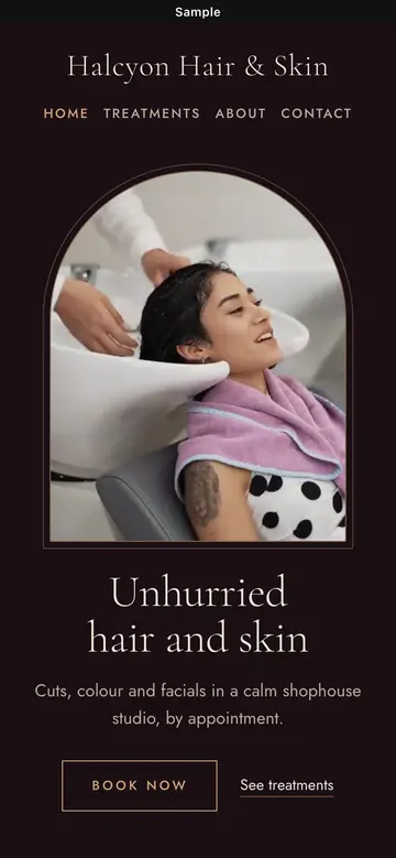 Sample Dark luxe website for a salon, on a phone